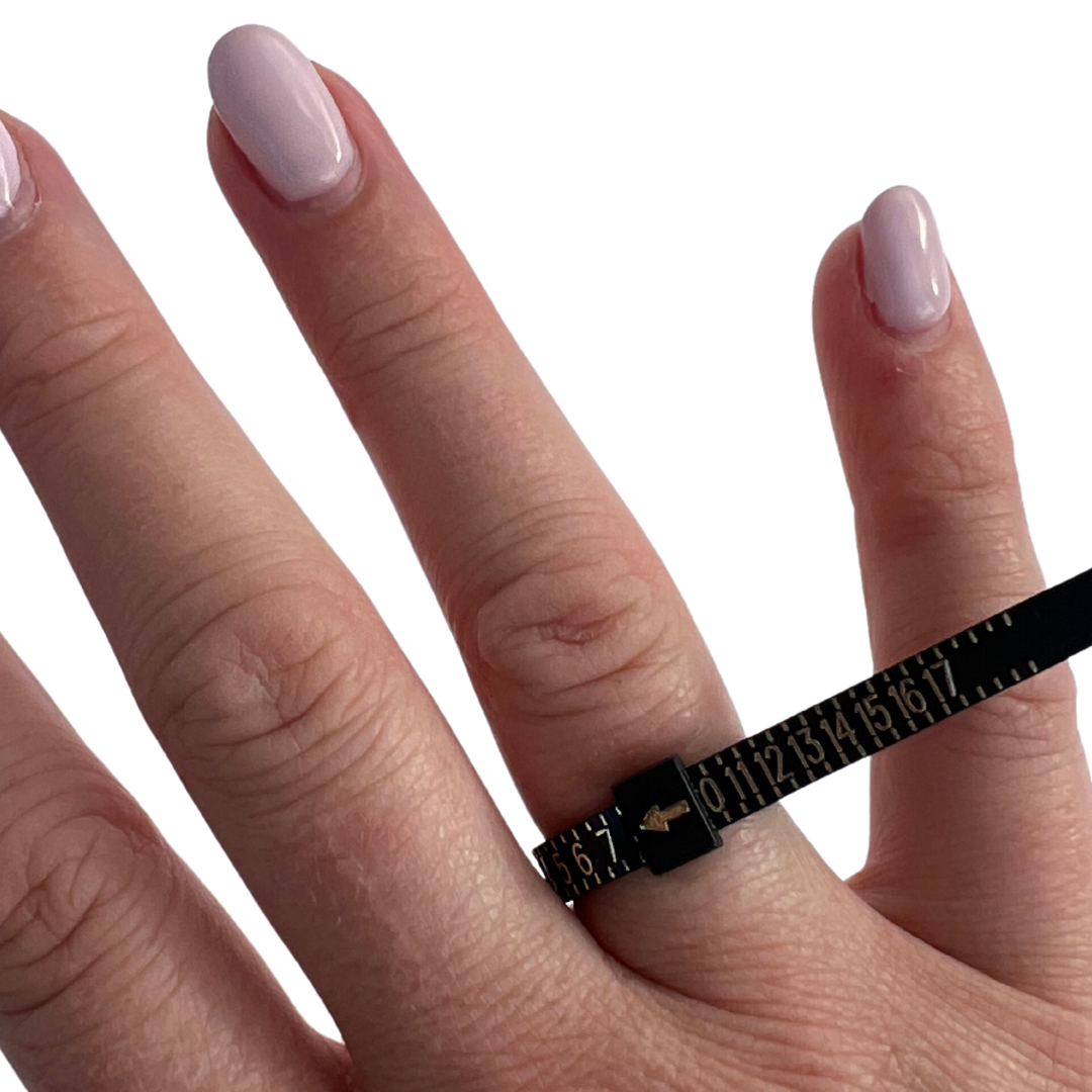This ring sizer tool is to help you find your ring size at home. Simply wrap it around your finger, thread the end through the opening and pull it until it fits snug