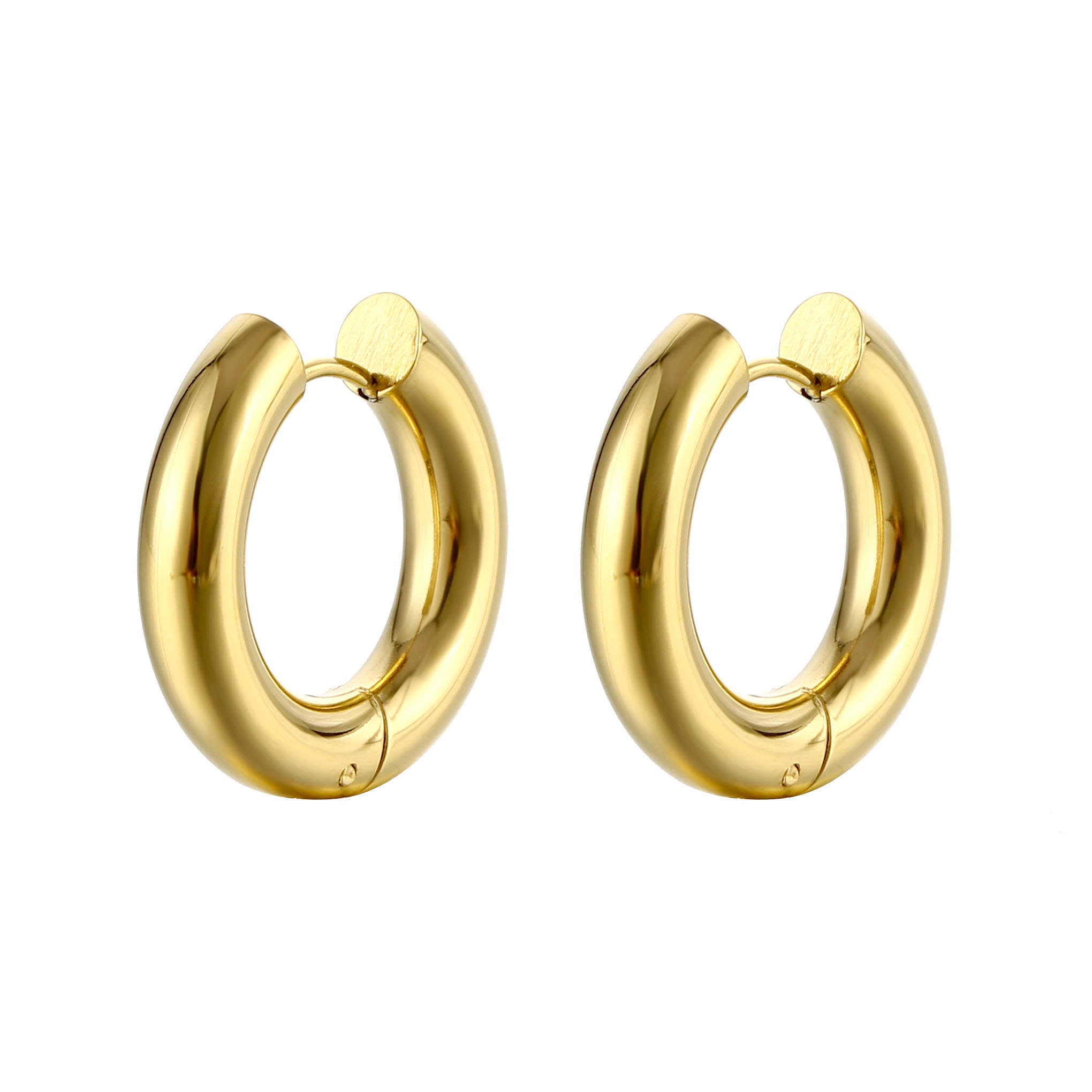 The traditional design of these Esmé hoops exudes a sense of timeless beauty. With their sleek and polished surface, they effortlessly elevate any outfit
Whether it'